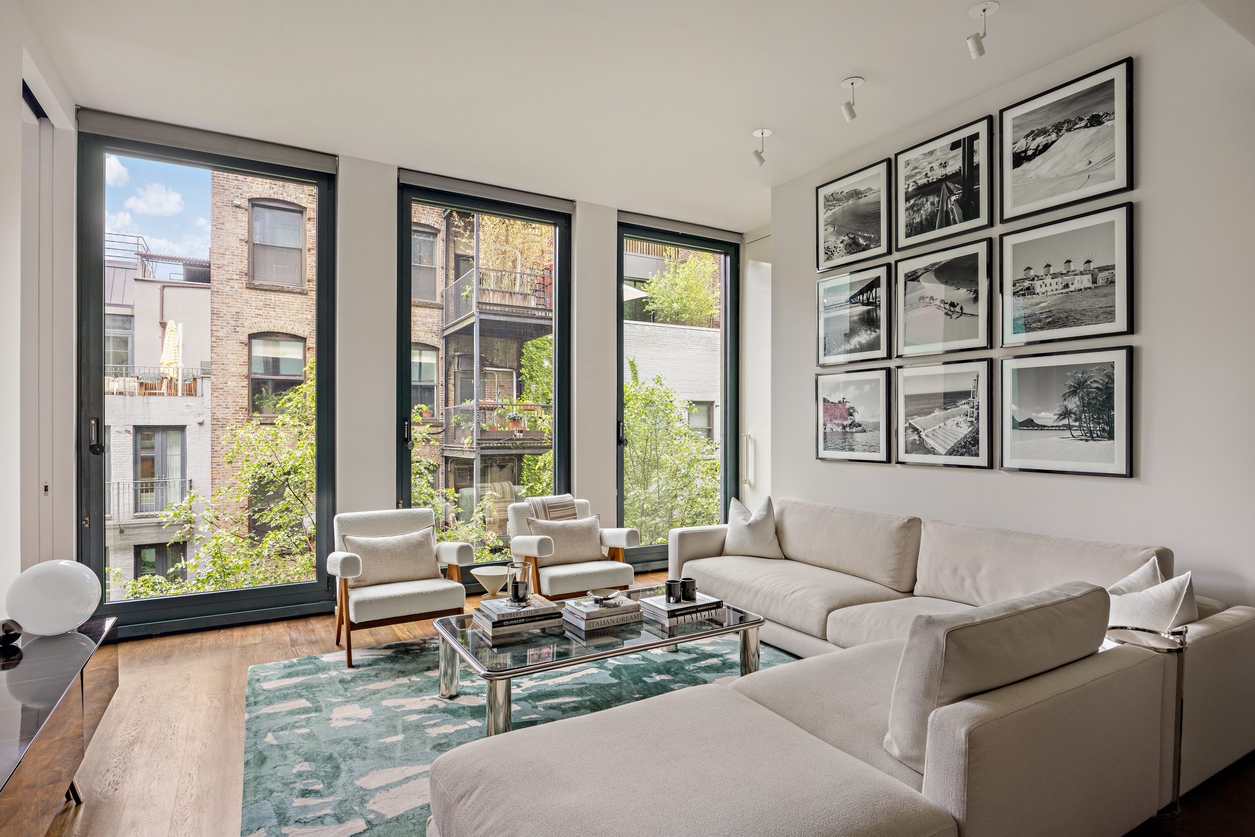 40 Bond Street, Unit 6D Manhattan, NY 10012 - Photo 1 of 23 a living room with furniture and a large window