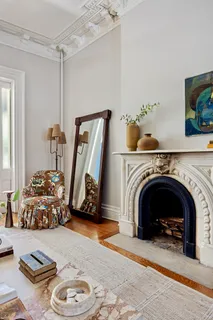 a view of a livingroom with furniture and a fireplace