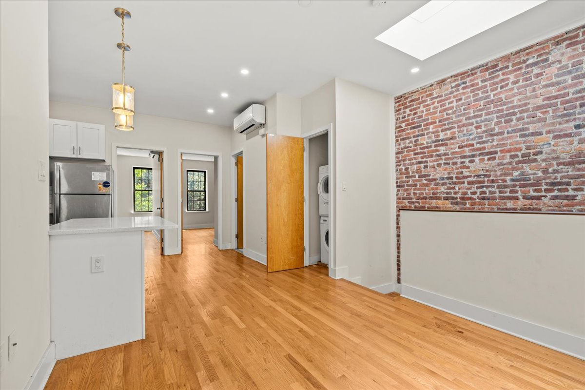 1773 Nostrand Avenue Brooklyn, NY 11226 - Photo 2 of 10 a view of an empty room with kitchen and a window