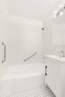 a bathroom with a bathtub and a sink