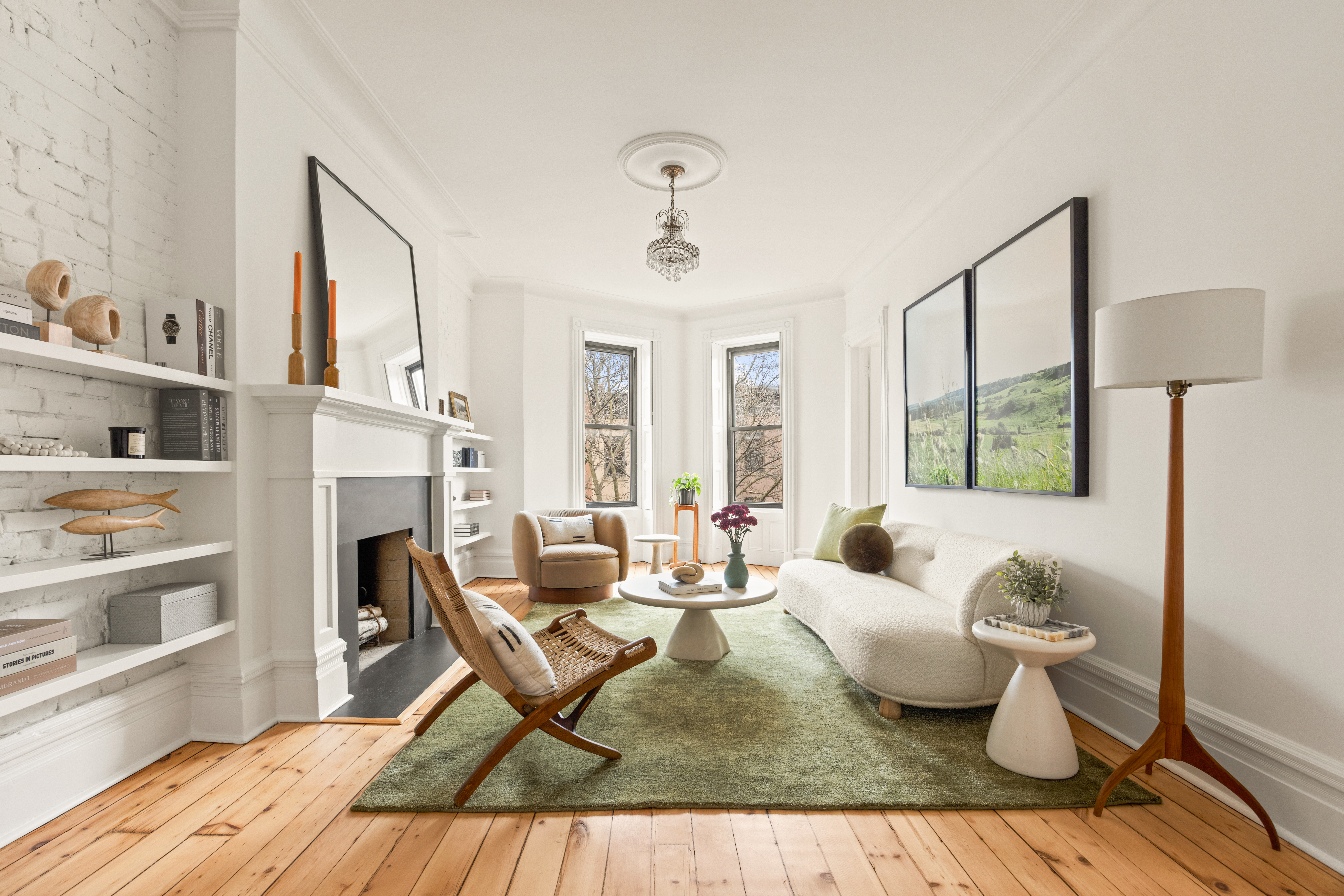 a living room with fireplace furniture and a window