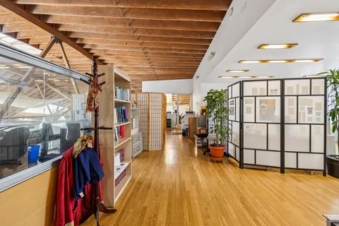 a bedroom with a workspace