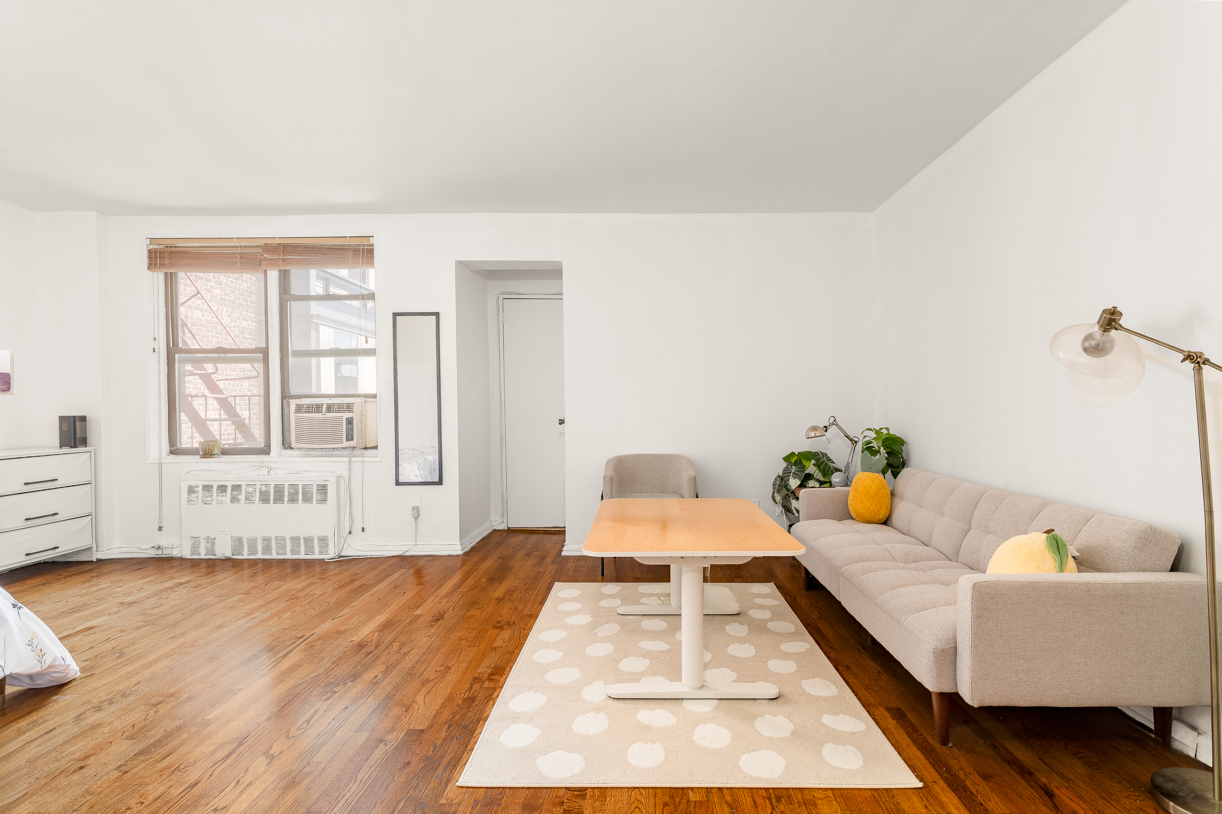 1420 York Avenue, Unit 6J Manhattan, NY 10021 - Photo 1 of 13 a bedroom with a bed and wooden floor