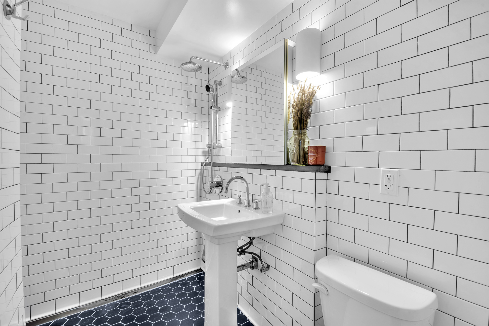 361 6th Avenue, Unit 1 Brooklyn, NY 11215 - Photo 8 of 11 a bathroom with a sink a toilet and shower