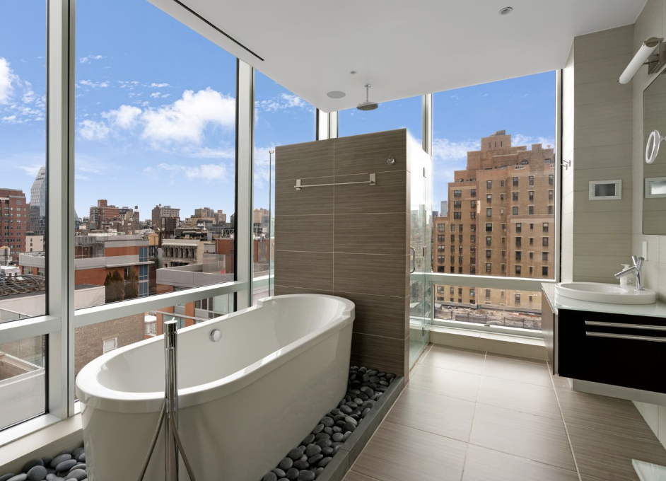 166 West 18th Street, Unit PHA Manhattan, NY 10011 - Photo 9 of 26 a bathroom with a bathtub and a shower