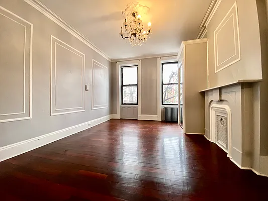 254 Wyckoff Street, Unit 2L Brooklyn, NY 11217 - Photo 2 of 8 a view of an empty room with wooden floor and a window