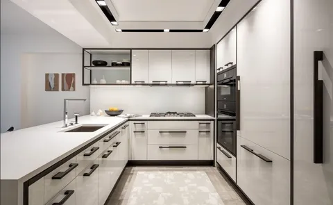 a kitchen with stainless steel appliances a sink and a refrigerator