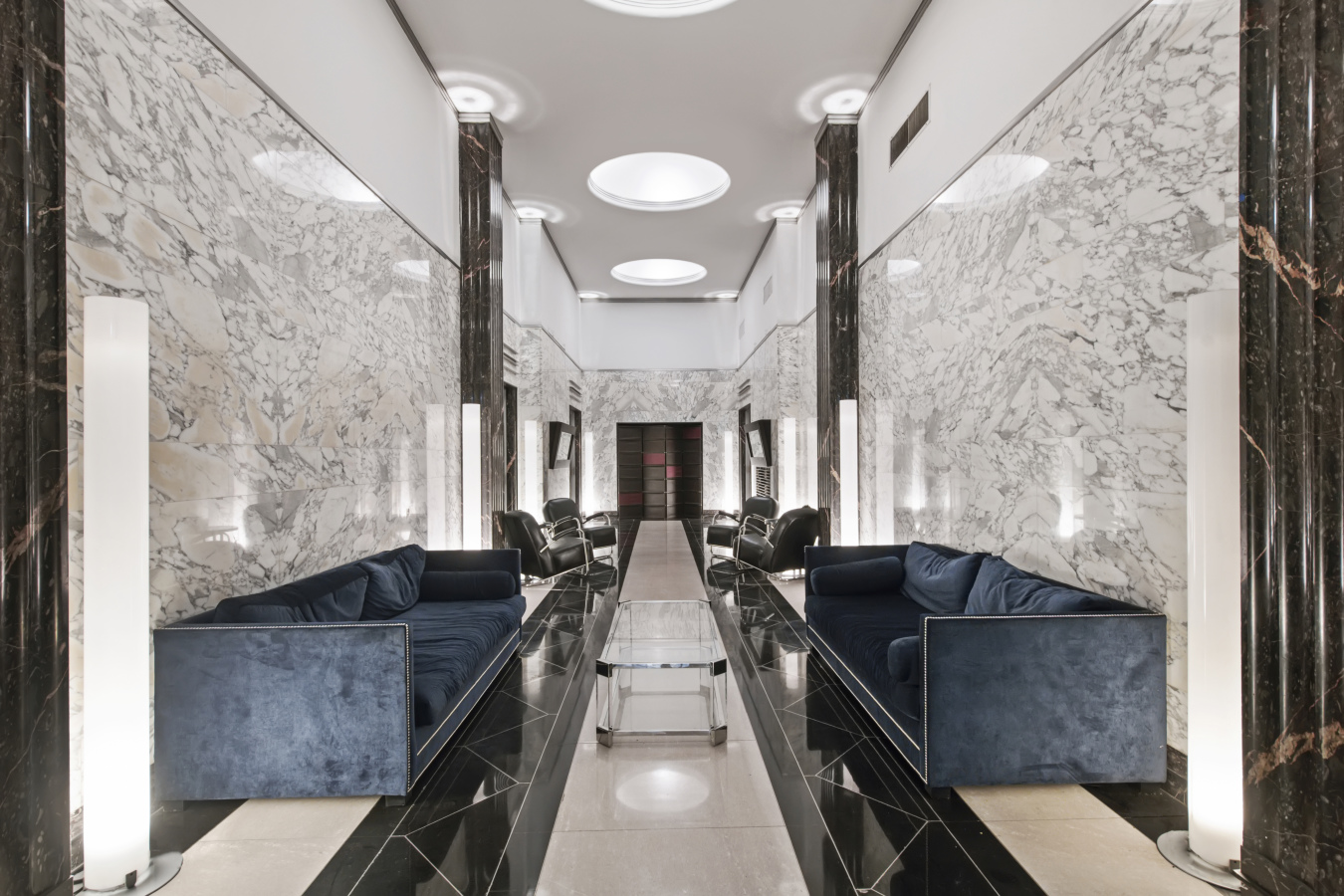 99 John Street, Unit 522 Manhattan, NY 10038 - Photo 8 of 11 a living room with furniture and a large window