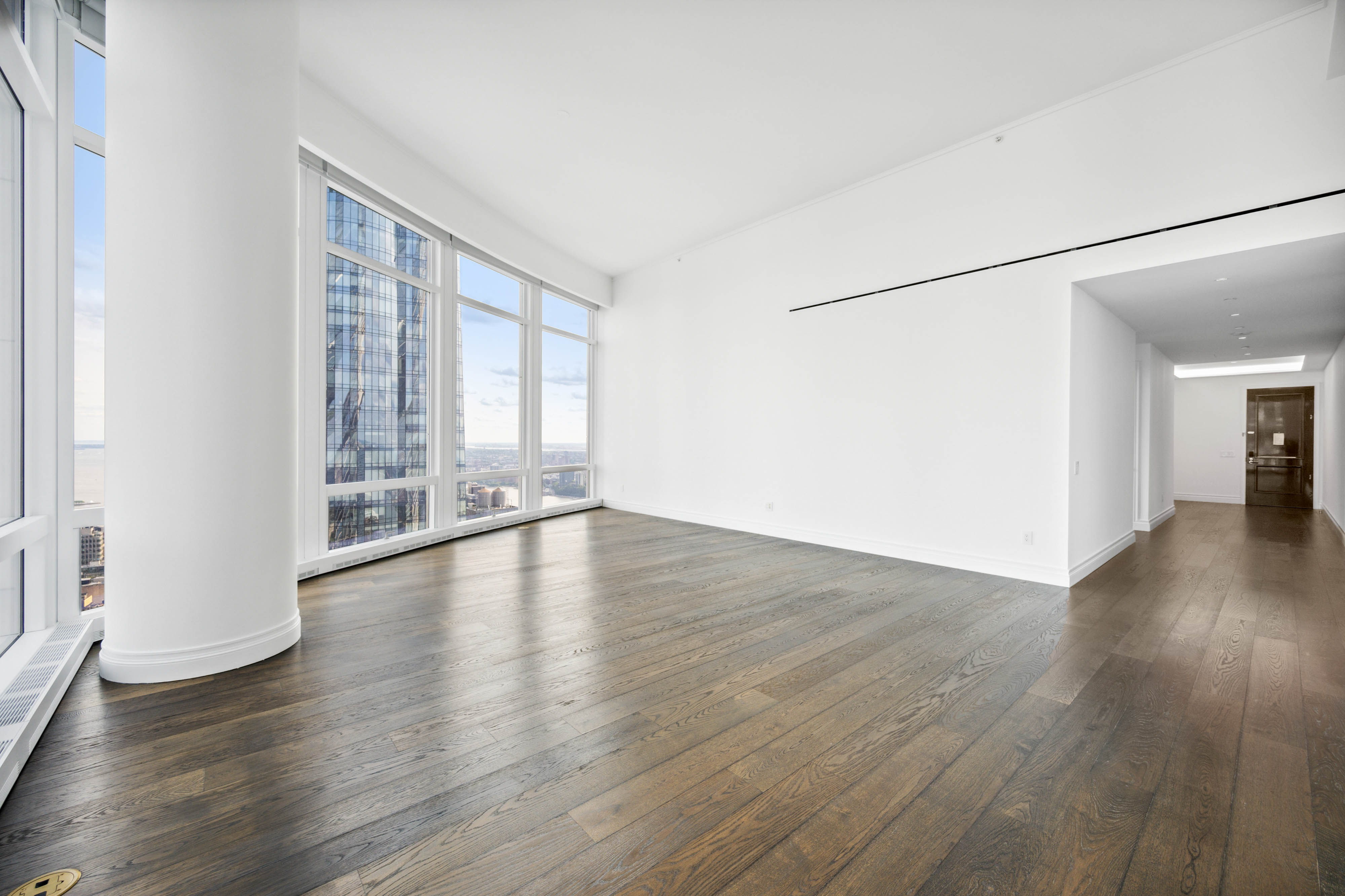 35 Hudson Yards, Unit 7204 Manhattan, NY 10001 - Photo 1 of 1 an empty room with wooden floor and windows