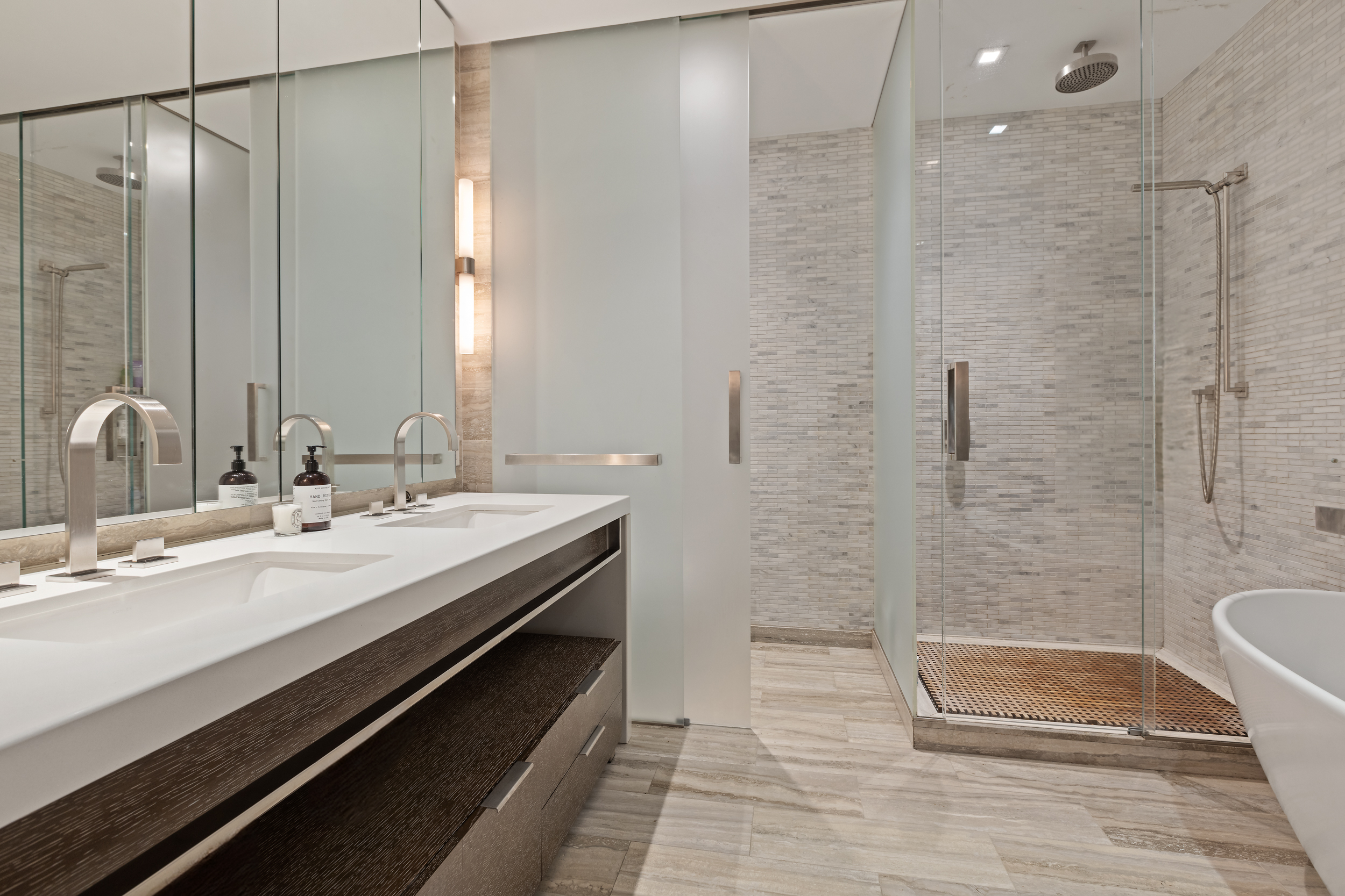 400 West 12th Street, Unit 3F Manhattan, NY 10014 - Photo 6 of 15 a bathroom with a granite countertop sink a toilet and shower