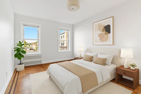 a bedroom with bed and window