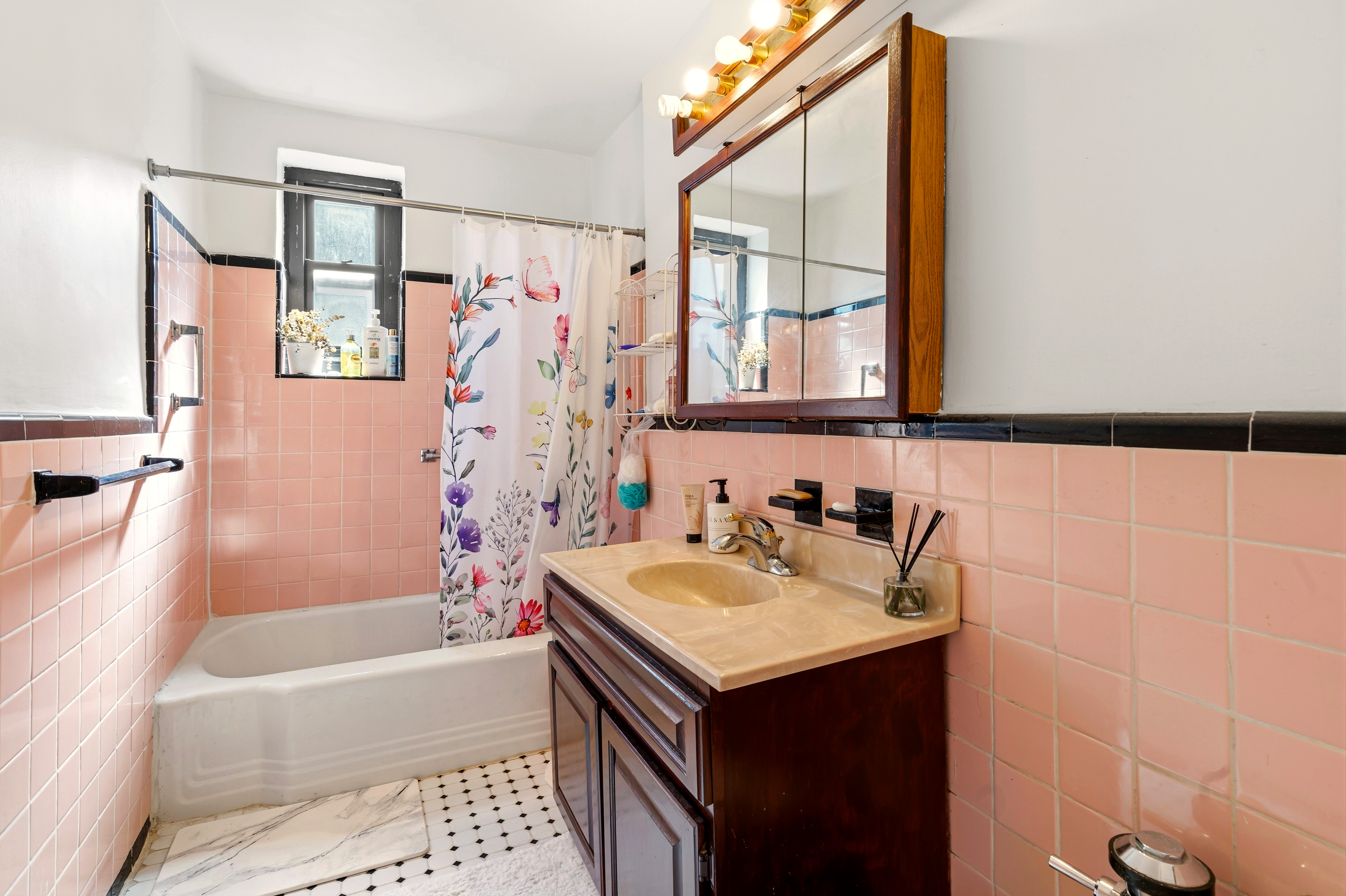 32-40 91st Street, Unit 510 Queens, NY 11369 - Photo 4 of 5 a bathroom with a sink mirror toilet and bathtub
