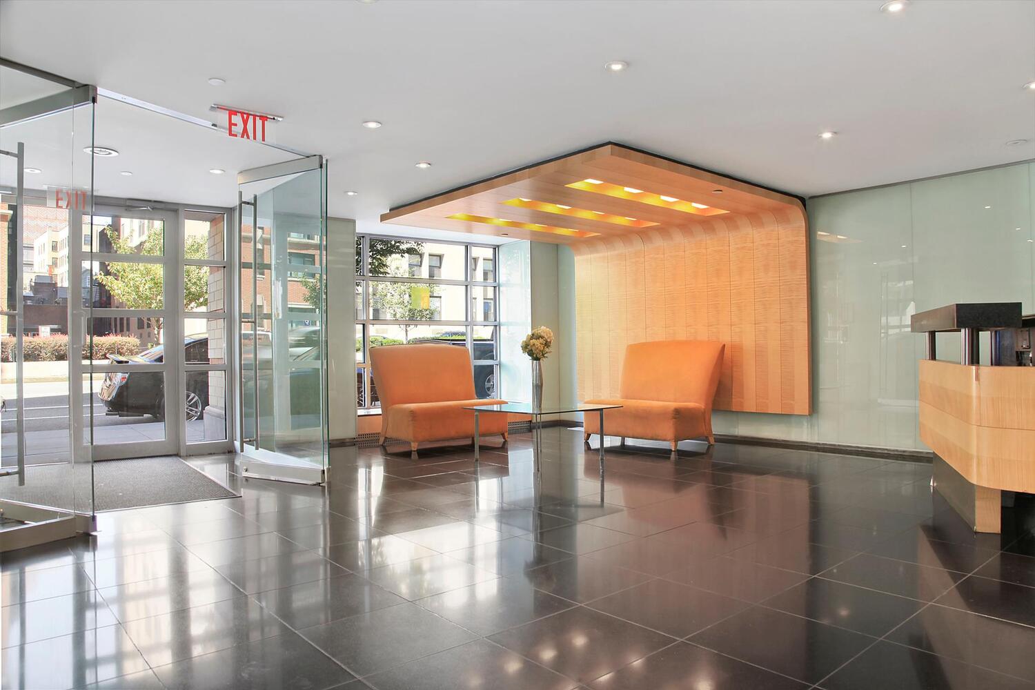 53 Boerum Place, Unit 2J Brooklyn, NY 11201 - Photo 6 of 9 a lobby with furniture and floor to ceiling window