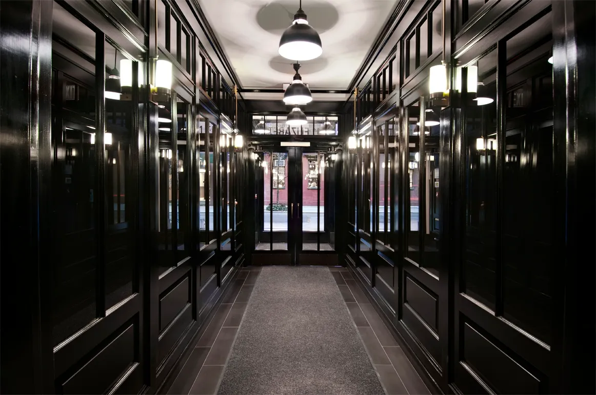 a view of a hallway with chandelier