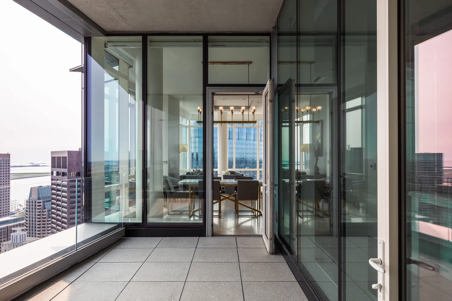 a view of a balcony with floor to ceiling window