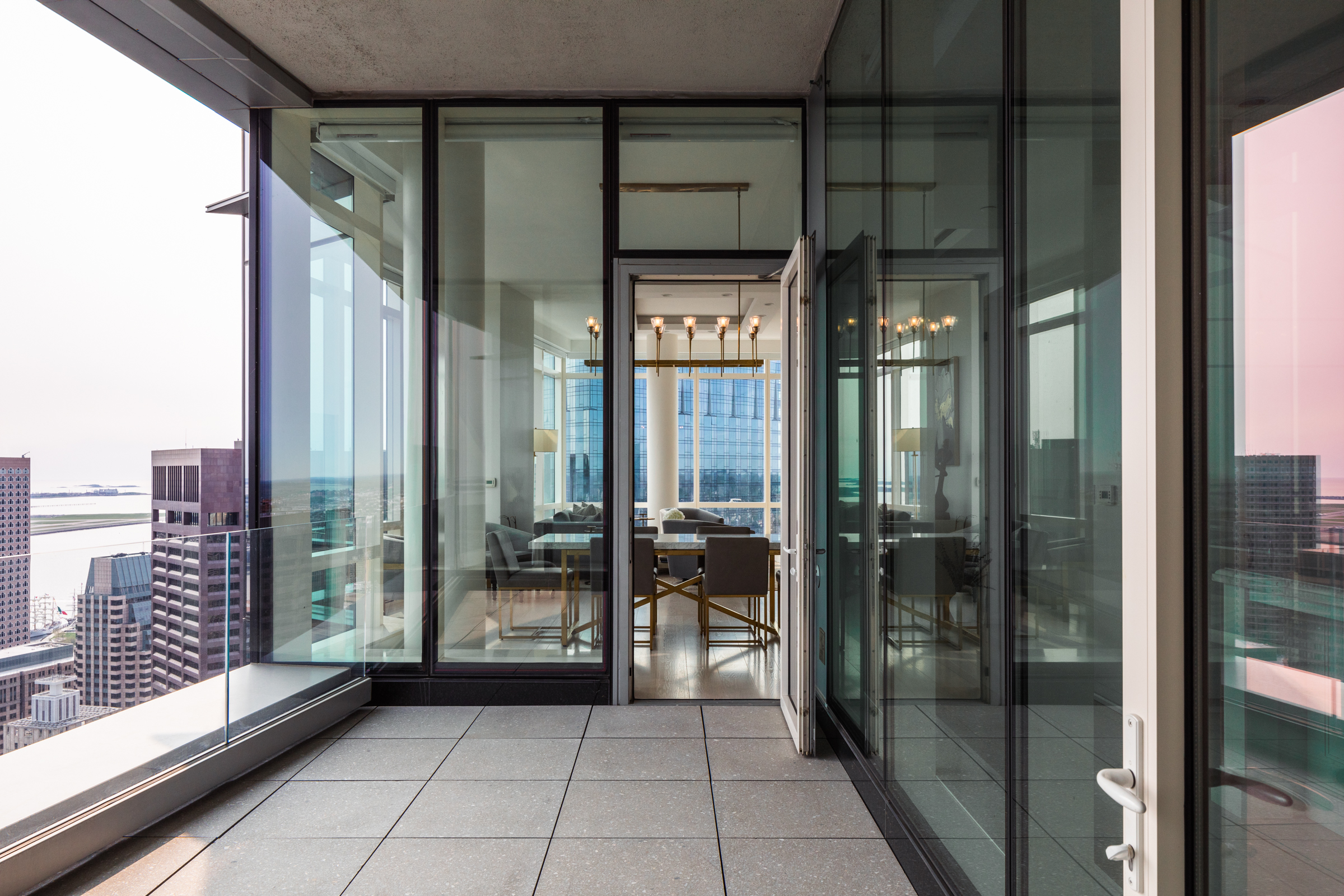 1 Franklin Street, Unit PH2D Boston, MA 02110 - Photo 7 of 26 a view of a balcony with floor to ceiling window