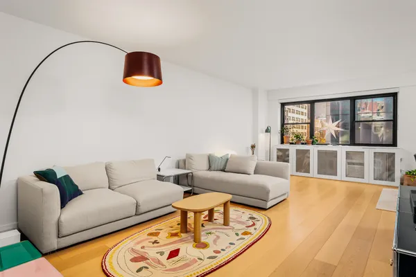 a dining room with furniture and wooden floor