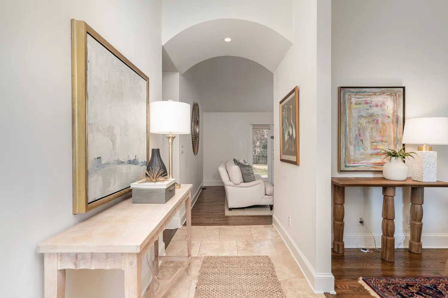 a living room with a couch and chandelier