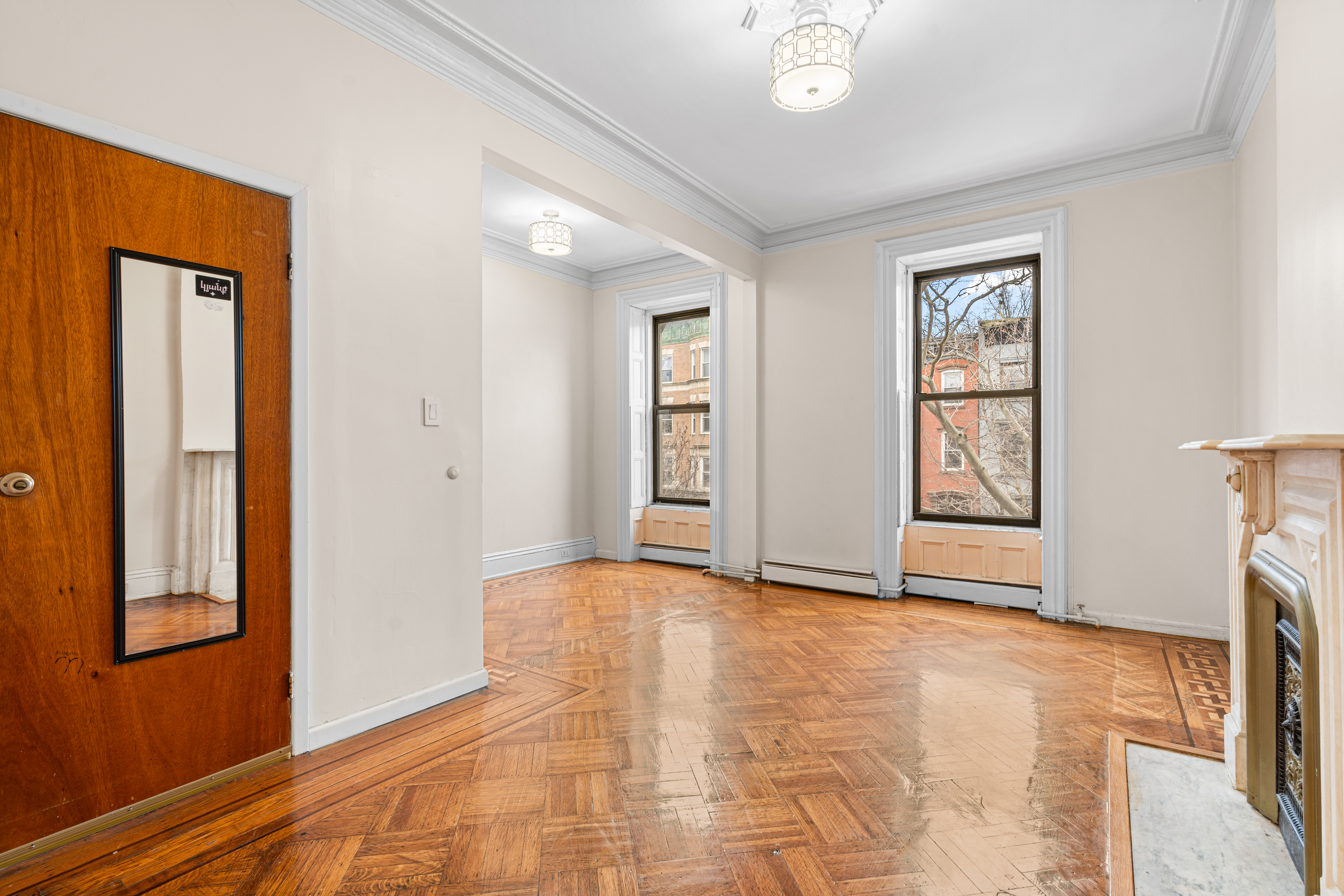 51 Herkimer Street, Unit 2 Brooklyn, NY 11216 - Photo 6 of 10 an empty room with windows and closet