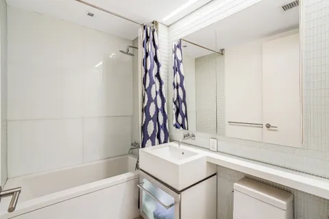 a bathroom with a sink and a bathtub