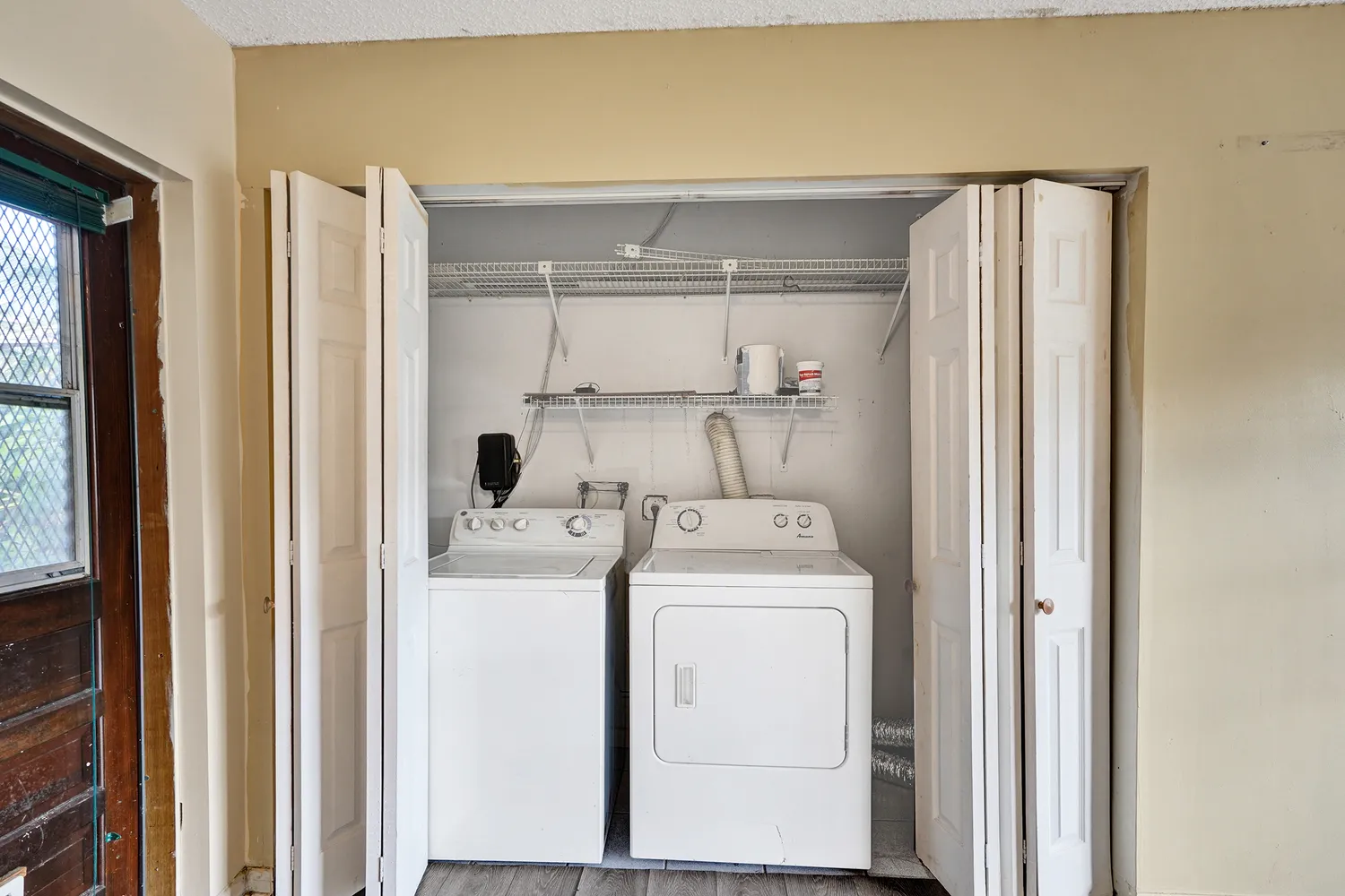 a view of a house with swimming pool and sitting area