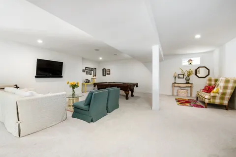 a view of a livingroom with furniture and a flat screen tv