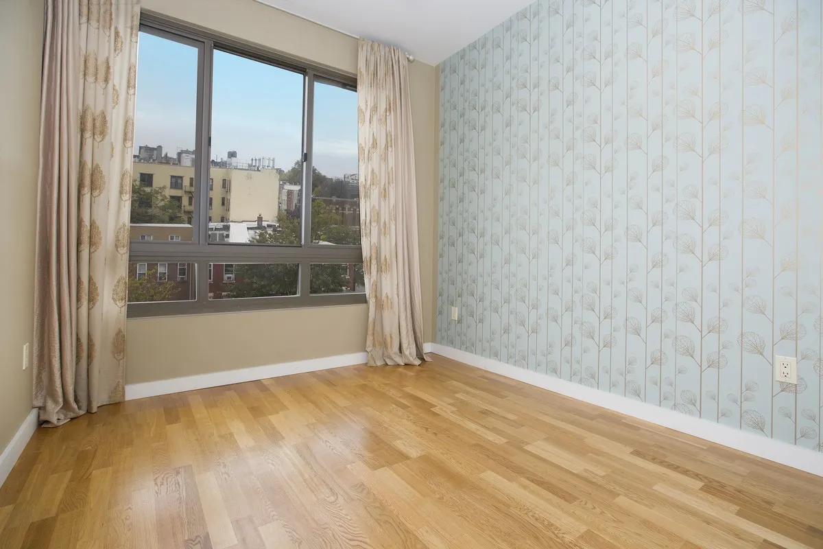 a view of an empty room with a window