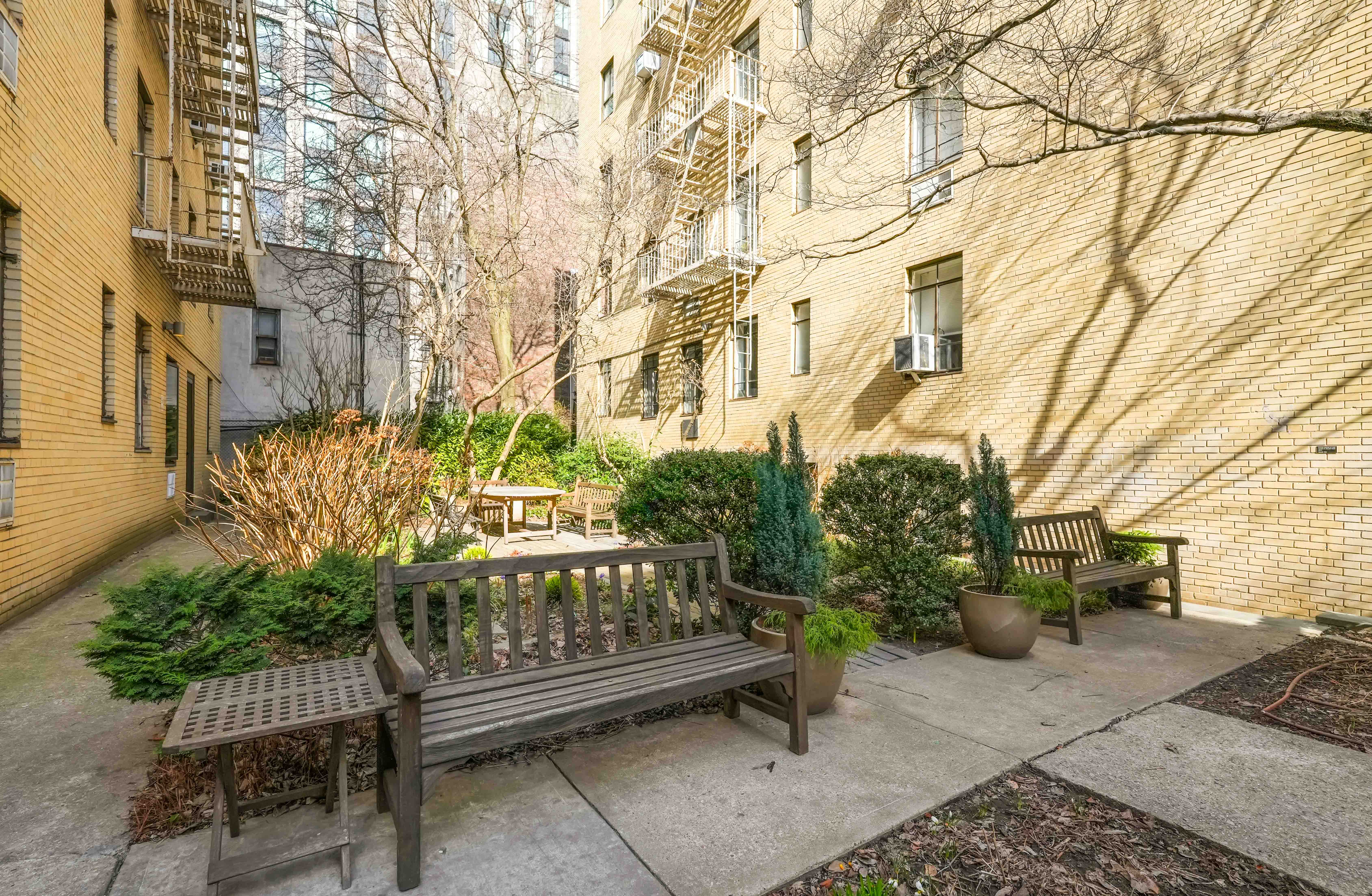 255 West 23rd Street, Unit 5GW Manhattan, NY 10011 - Photo 30 of 35 a view of a bench sitting in back yard of a building