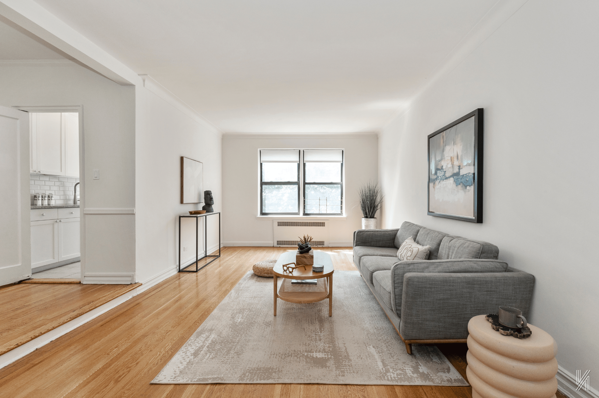 35-35 75th Street, Unit 428 Queens, NY 11372 - Photo 4 of 21 a living room with furniture and a large window