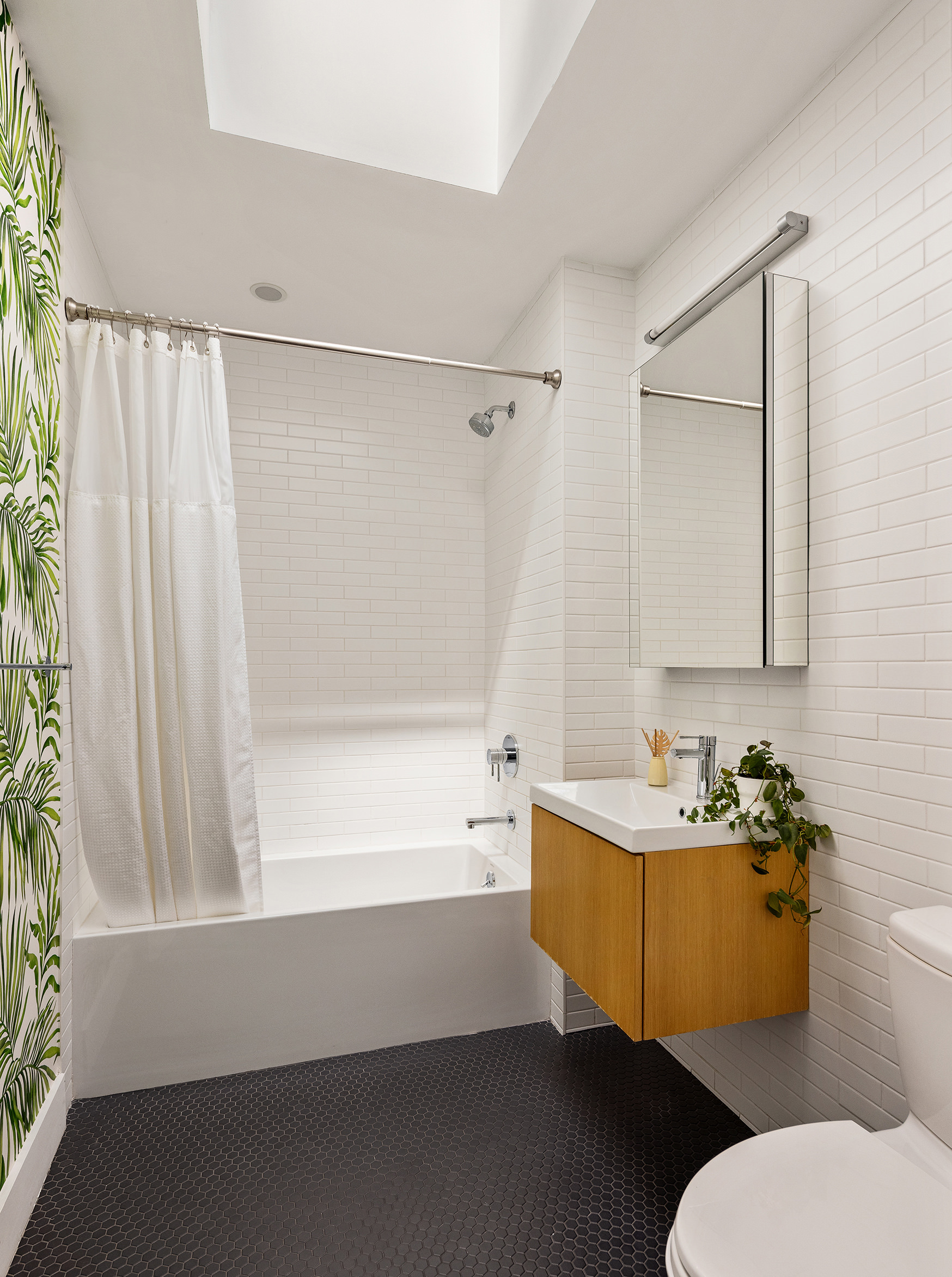 762 Park Place, Unit PH1 Brooklyn, NY 11216 - Photo 8 of 15 a bathroom with a sink mirror vanity and toilet