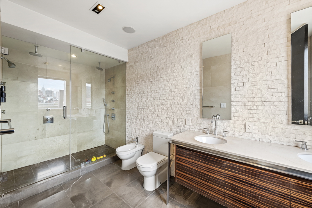405 Broadway, Unit PH Manhattan, NY 10013 - Photo 11 of 17 a bathroom with a sink double vanity and a bathtub