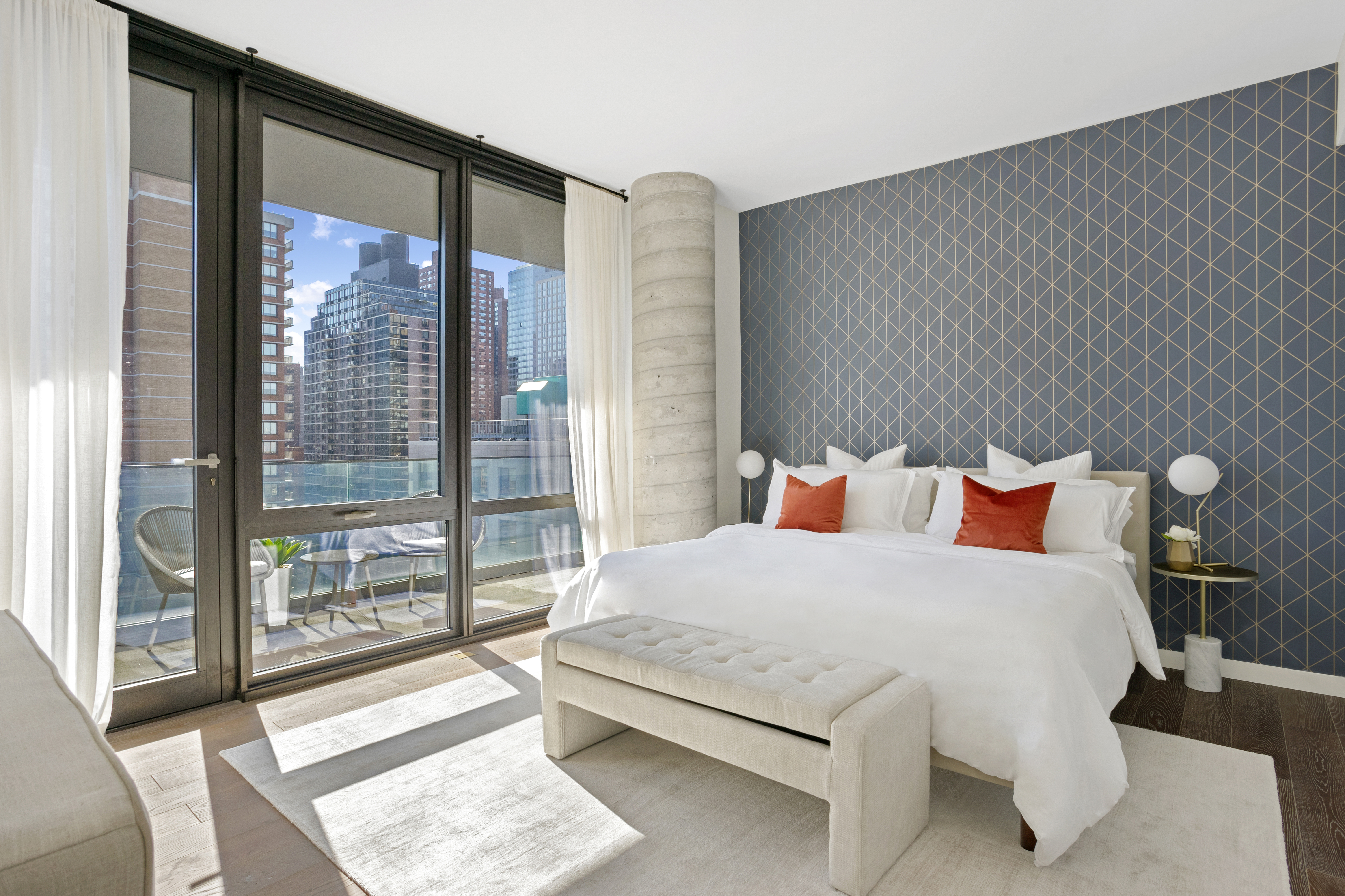 302 East 96th Street, Unit PH6 Manhattan, NY 10128 - Photo 6 of 13 a bedroom with a large bed and a large window