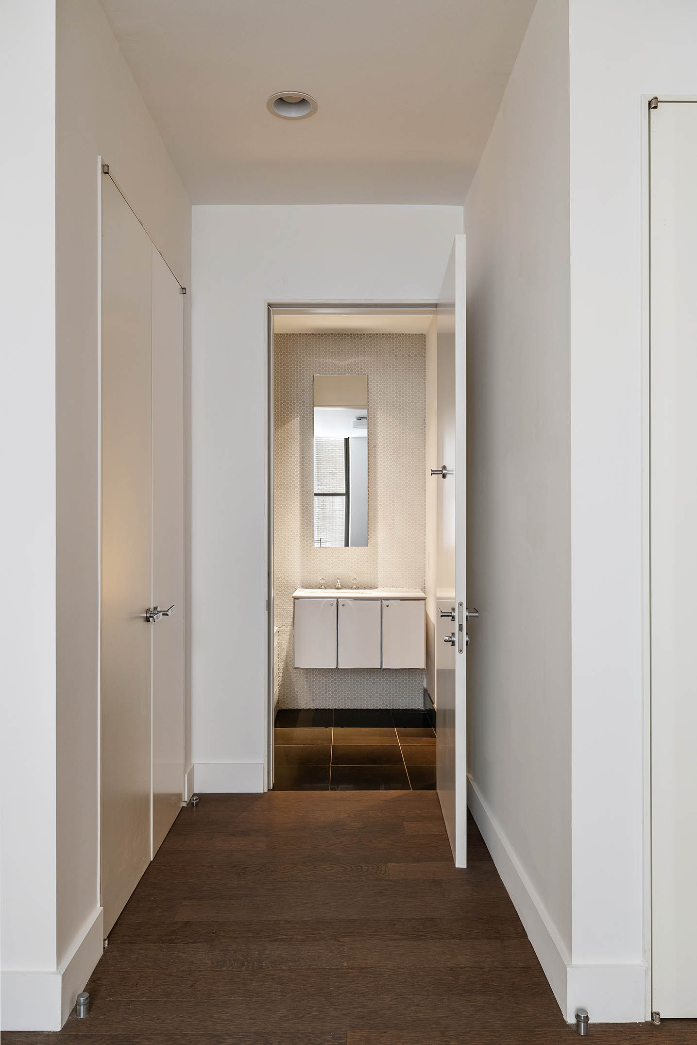 25 Broad Street, Unit 16I Manhattan, NY 10004 - Photo 15 of 23 a view of bedroom and bathroom