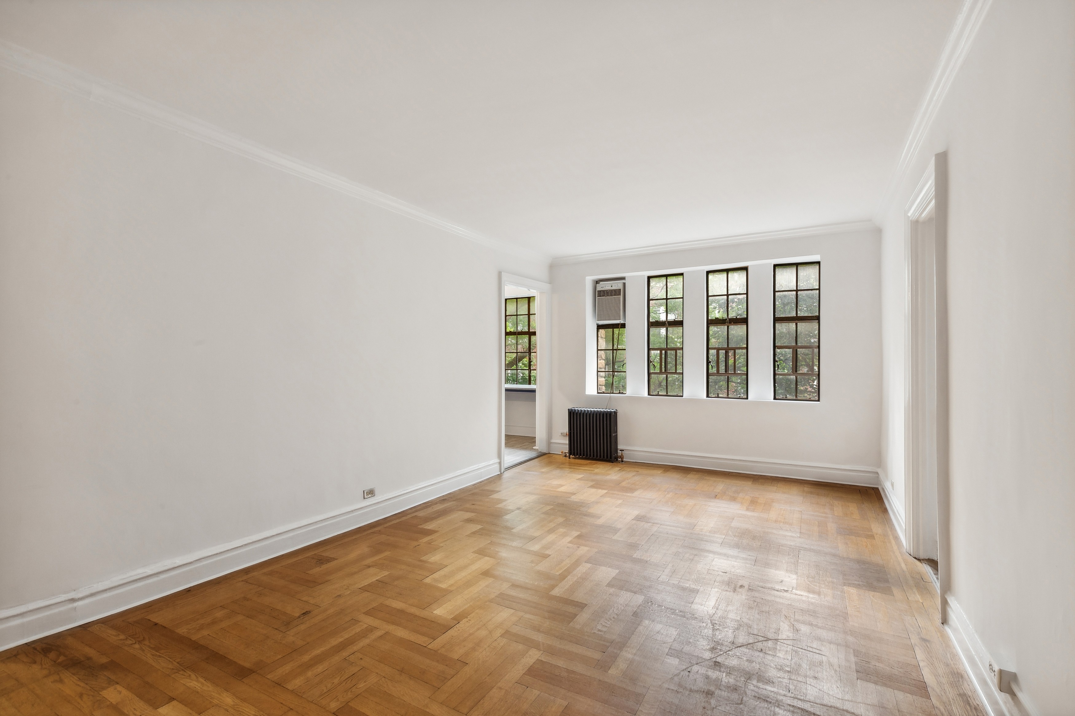 116 Pinehurst Avenue, Unit H32 Manhattan, NY 10033 - Photo 4 of 21 an empty room with windows