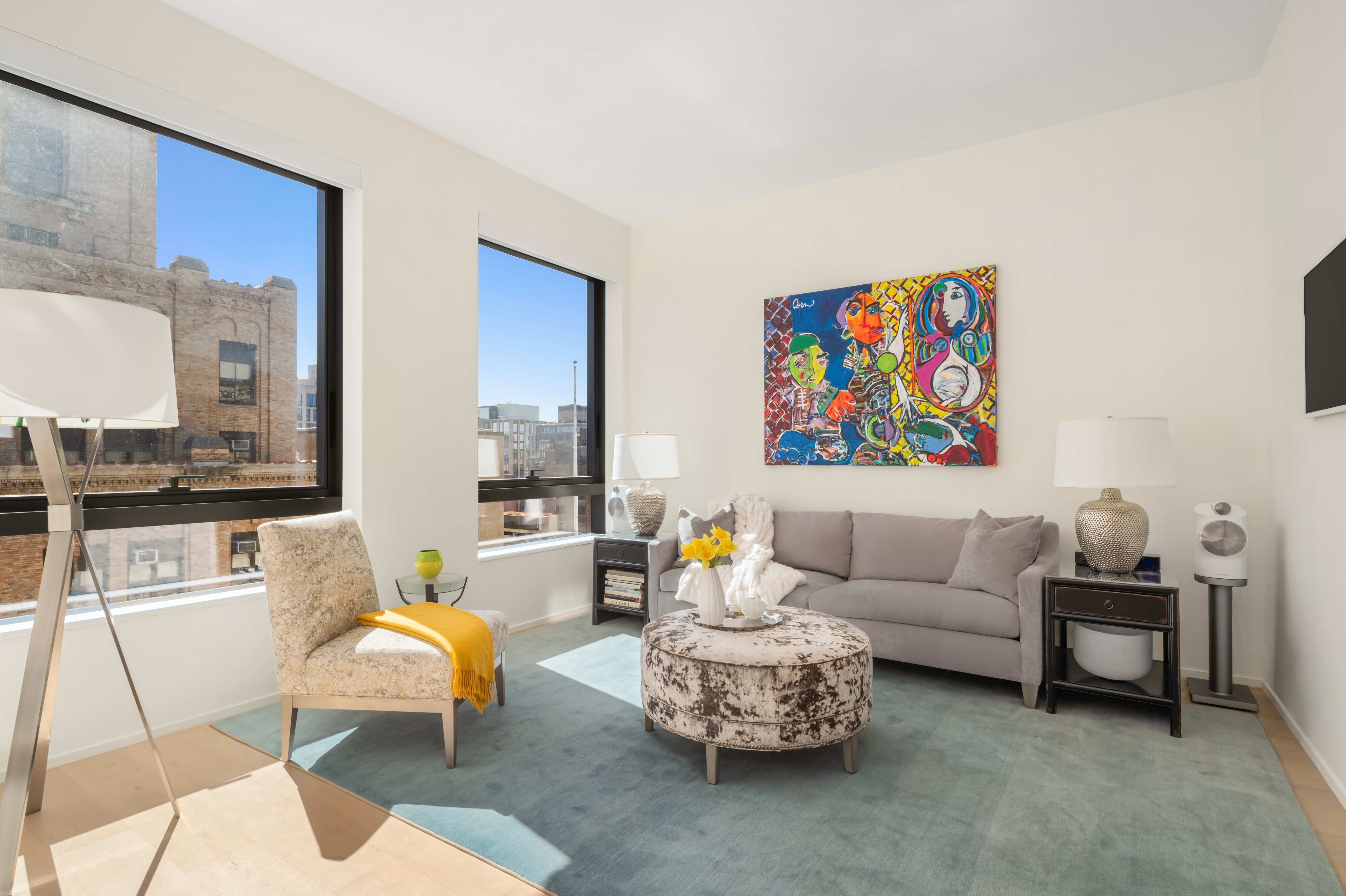 121 East 22nd Street, Unit N1405 Manhattan, NY 10010 - Photo 1 of 19 a living room with furniture and a floor to ceiling window