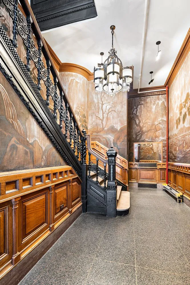 a view of a hallway with seating area