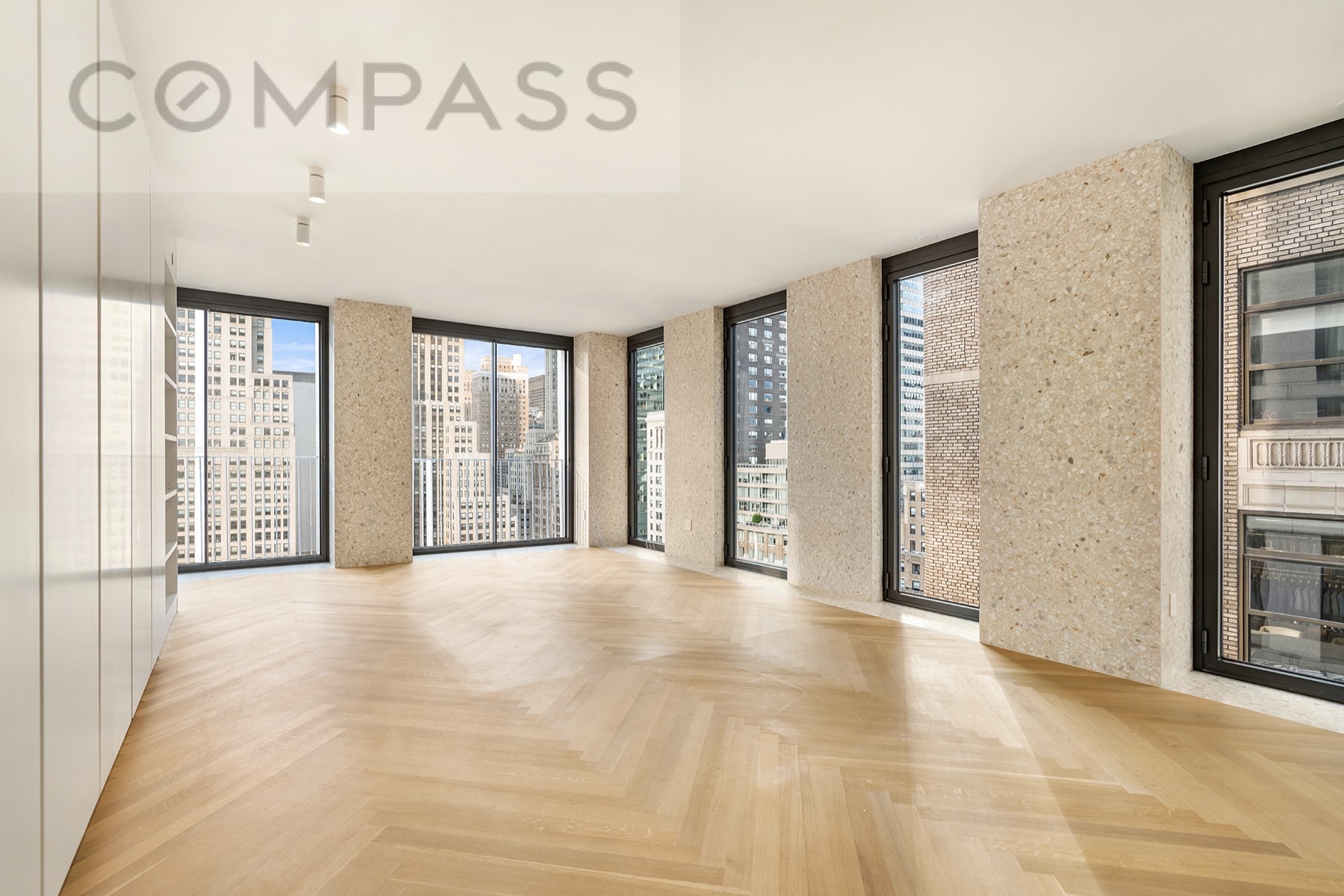 16 West 40th Street, Unit 21B Manhattan, NY 10018 - Photo 3 of 18 a view of an empty room with a window