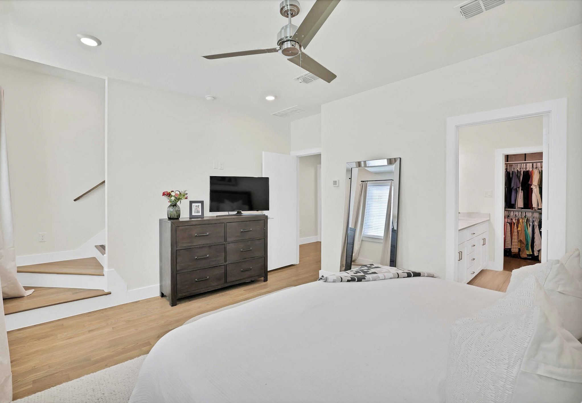 3920 Riesling Ridge Dallas, TX 75204 - Photo 17 of 26 a bedroom with a bed and a television