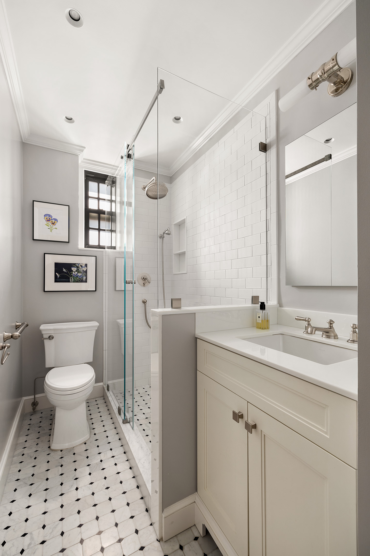 129 East 69th Street, Unit 8/9A Manhattan, NY 10021 - Photo 11 of 16 a bathroom with a sink toilet and shower