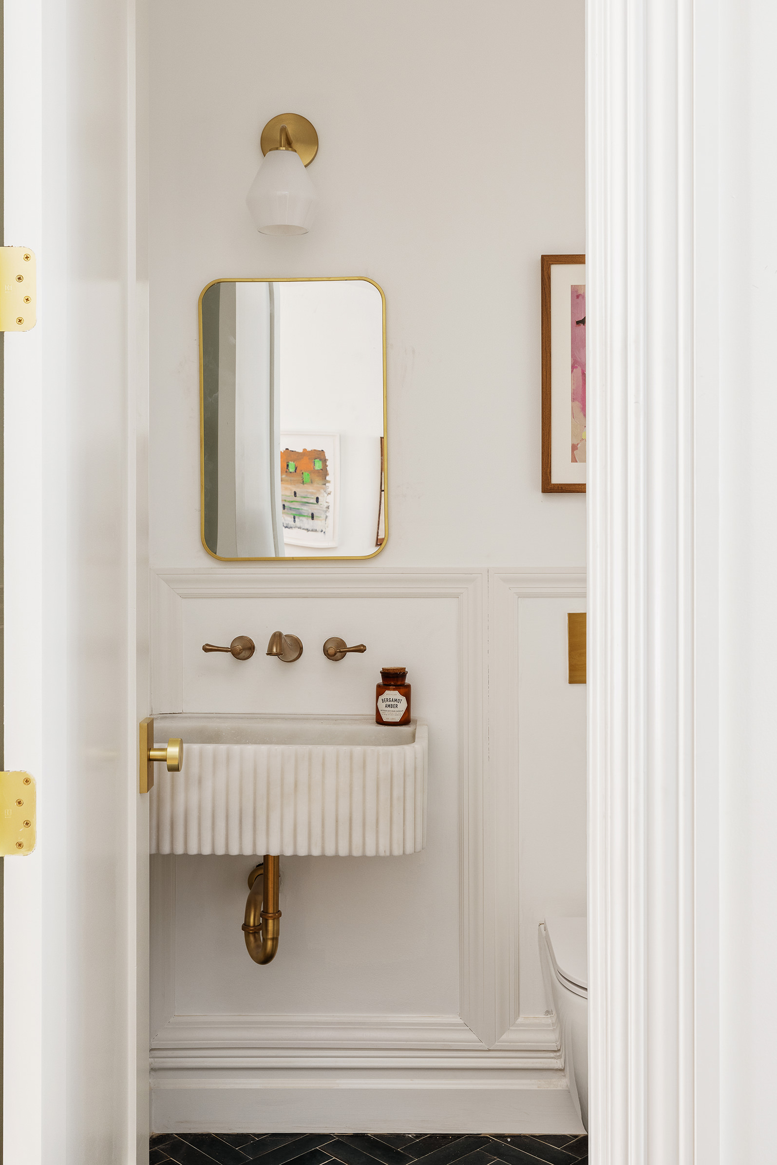 427 Quincy Street Brooklyn, NY 11221 - Photo 5 of 12 a bathroom with a sink and a mirror