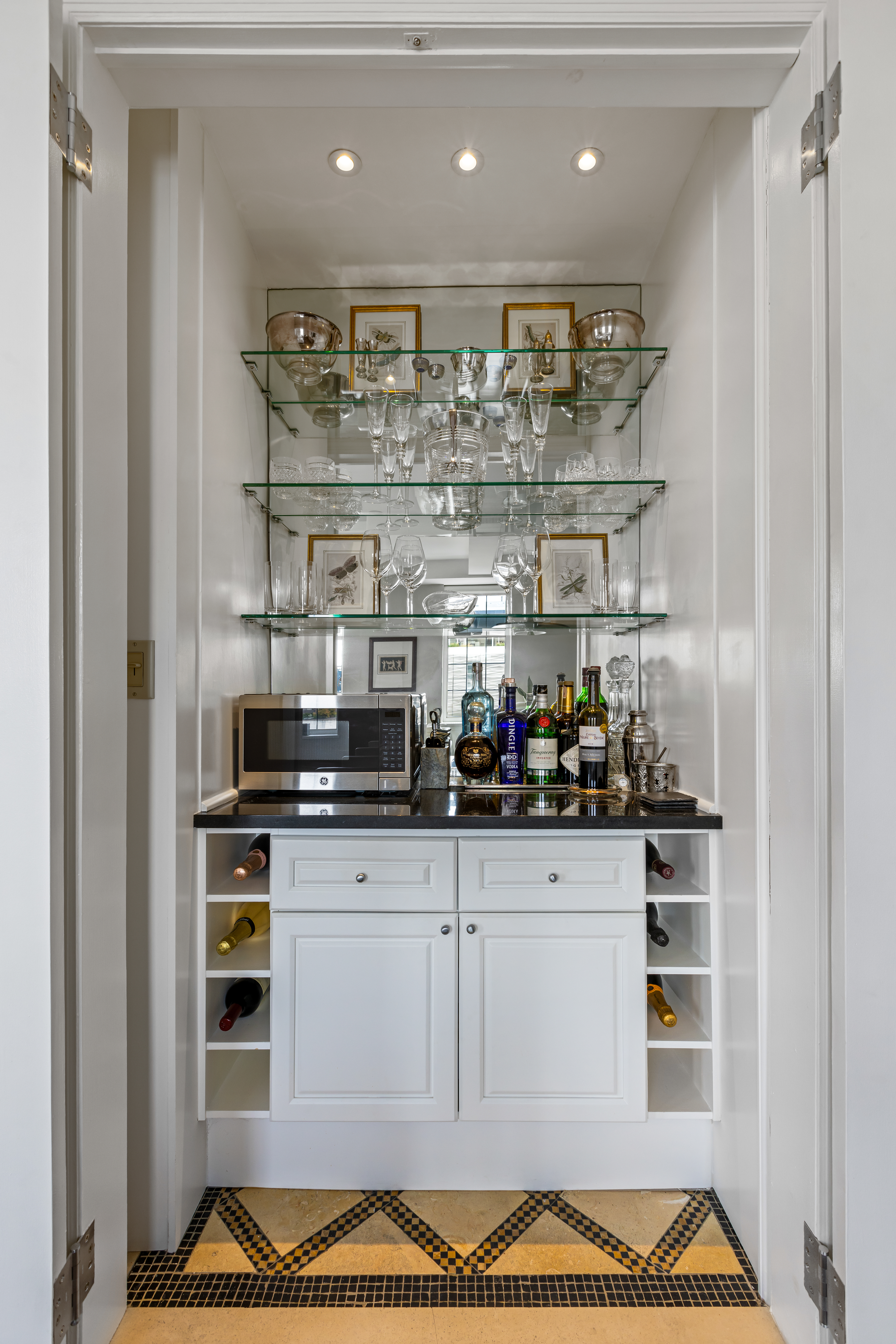 465 West 23rd Street, Unit 15B Manhattan, NY 10011 - Photo 6 of 19 a kitchen with stainless steel appliances granite countertop a refrigerator and a stove top oven