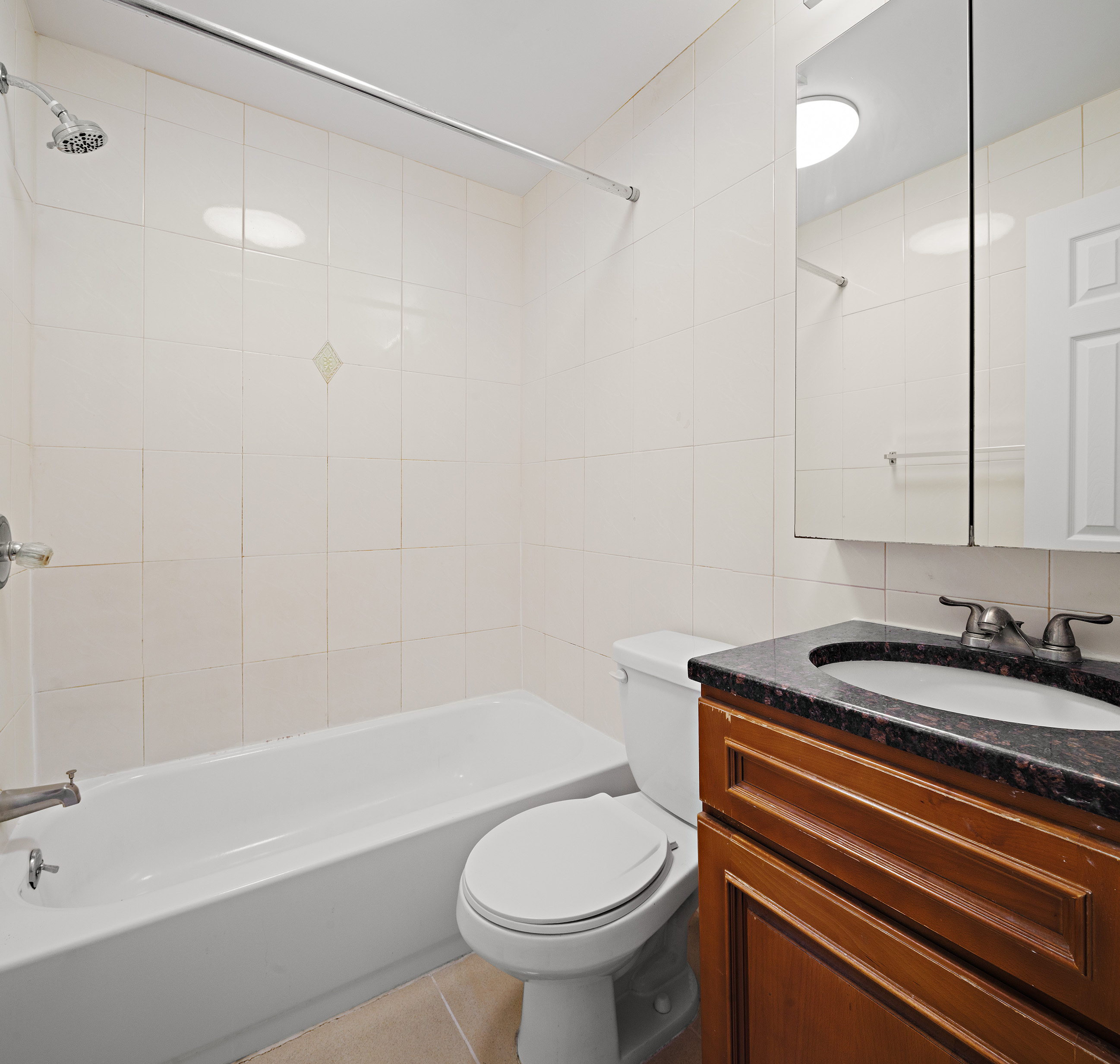 25 Bogart Street, Unit 3S Brooklyn, NY 11206 - Photo 4 of 7 a bathroom with a sink a toilet and shower