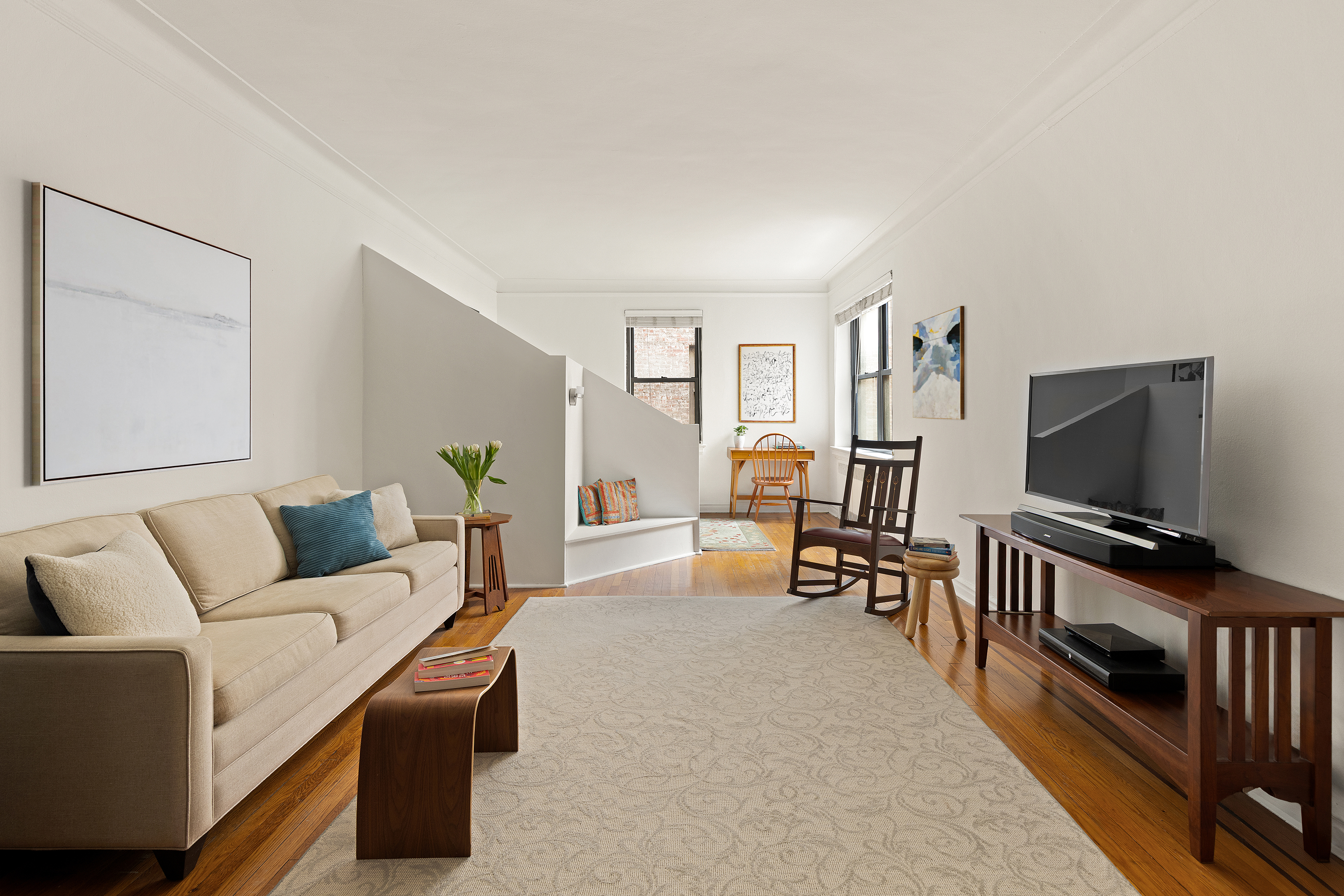 235 Lincoln Place, Unit 2D Brooklyn, NY 11217 - Photo 2 of 6 a living room with furniture and a flat screen tv