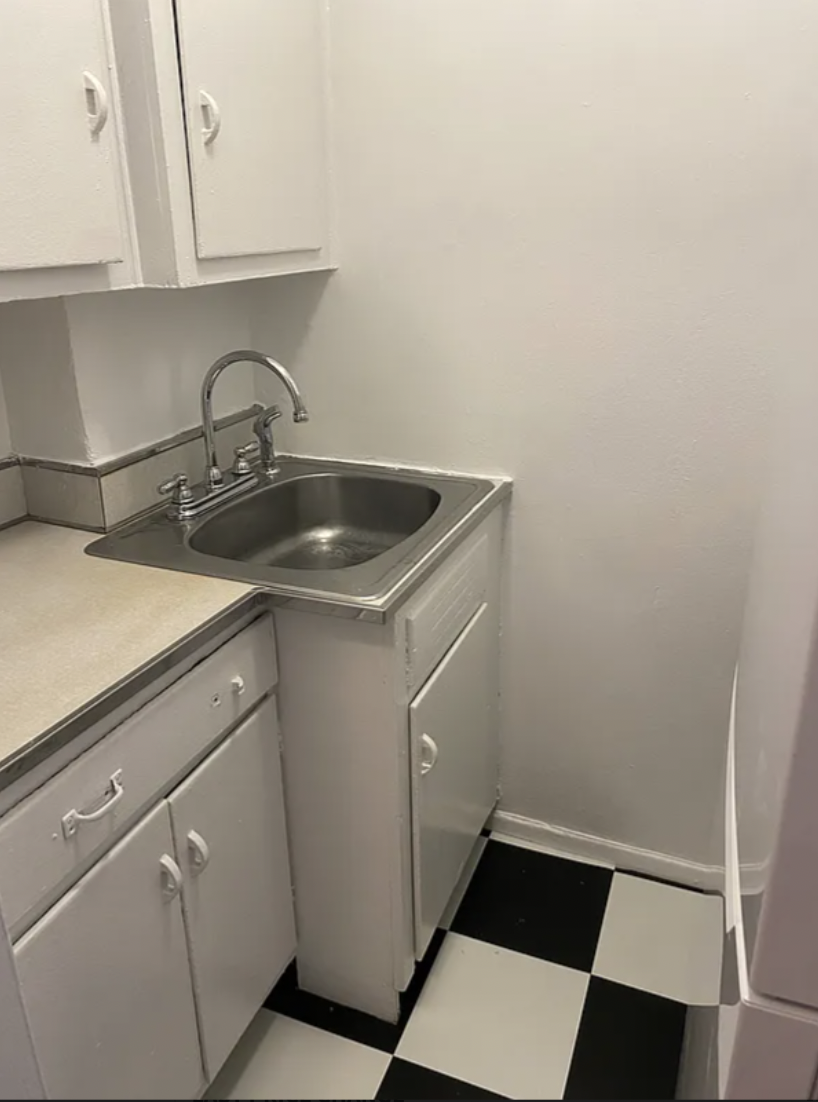 180 West Houston Street, Unit 4C Manhattan, NY 10014 - Photo 5 of 10 a kitchen with a sink and cabinets