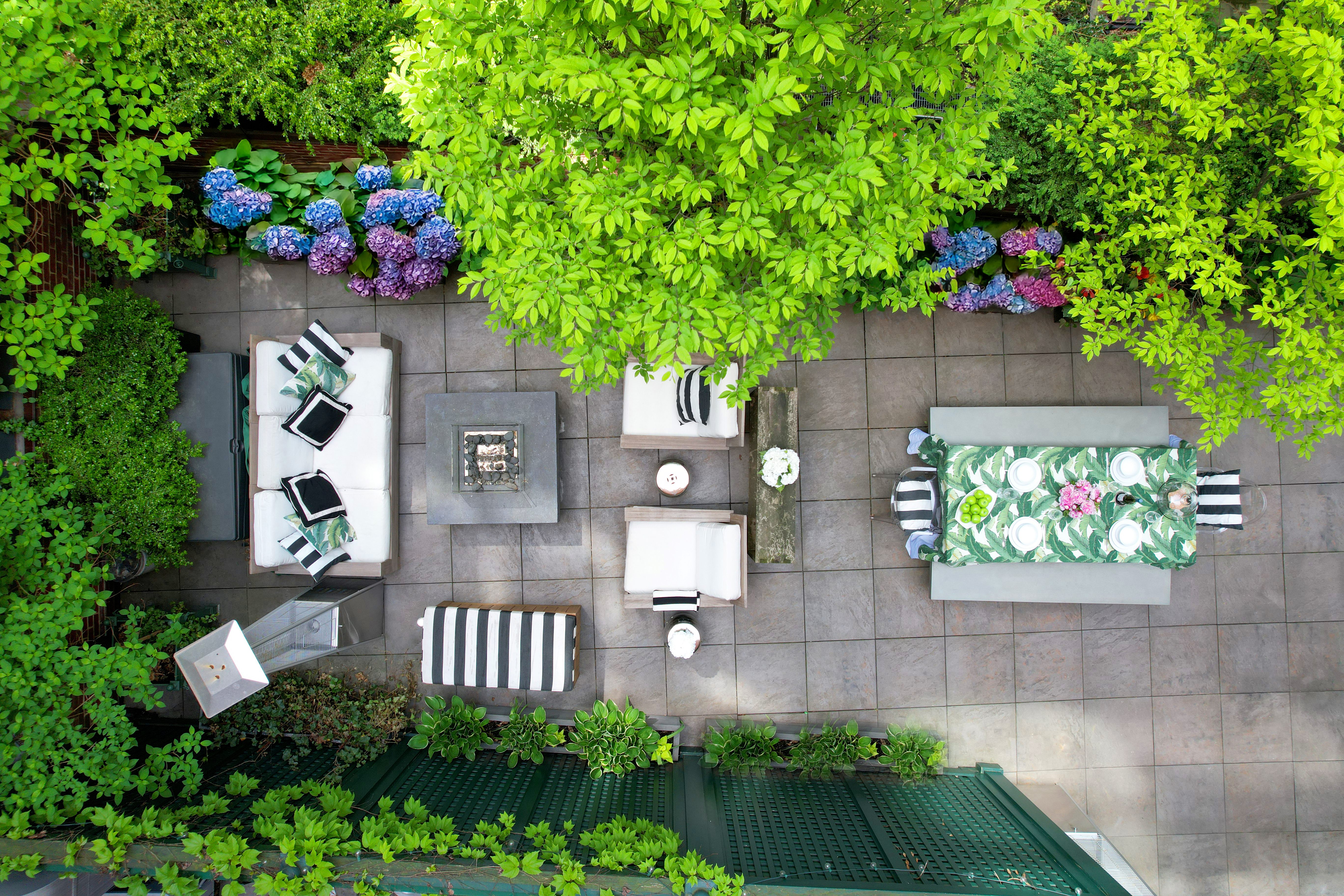 52 Laight Street, Unit R2 Manhattan, NY 10013 - Photo 1 of 21 a front view of a house with a yard and potted plants