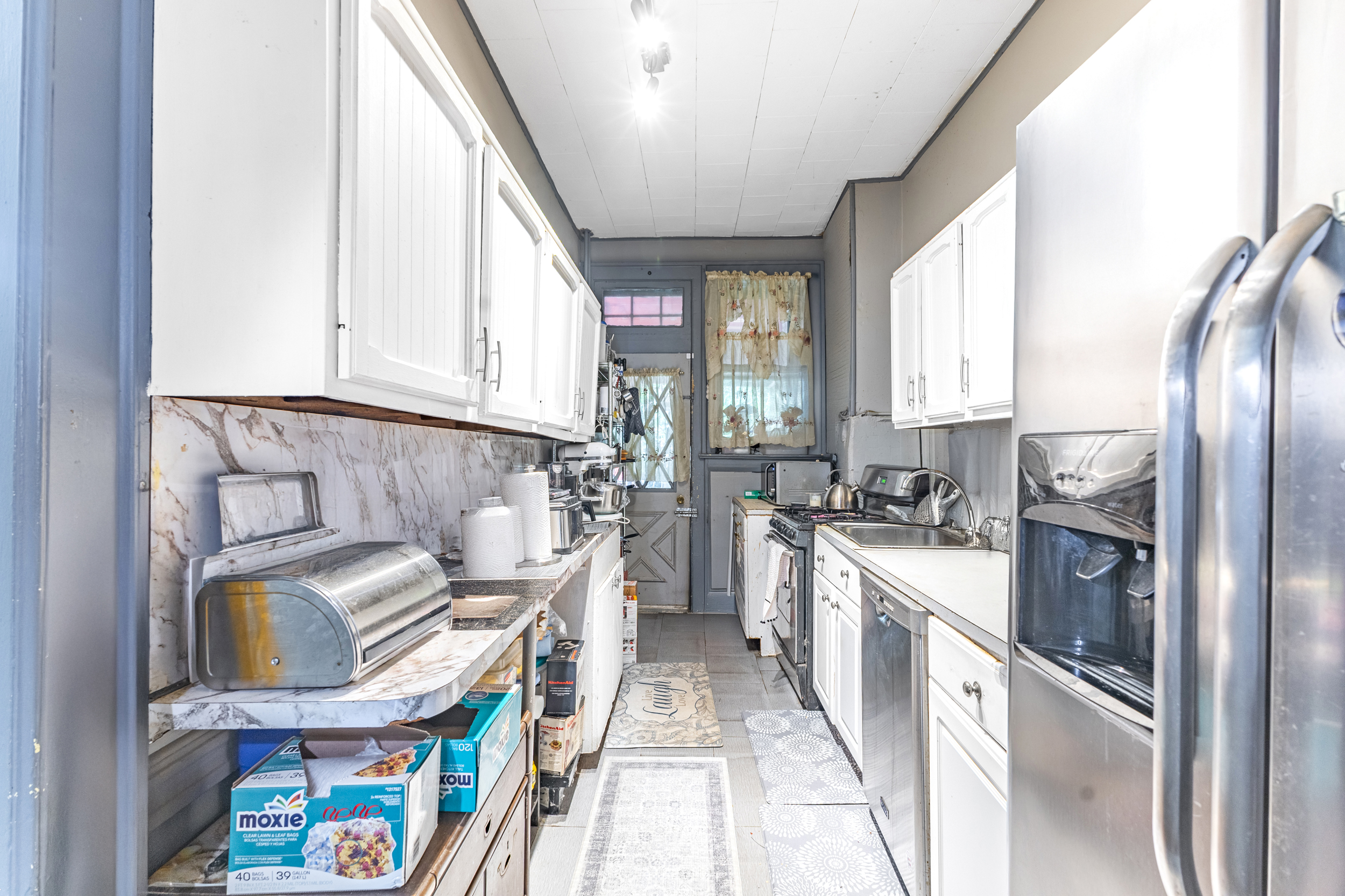 201 Maple Street Brooklyn, NY 11225 - Photo 15 of 21 a kitchen with stainless steel appliances granite countertop a stove a sink and a refrigerator