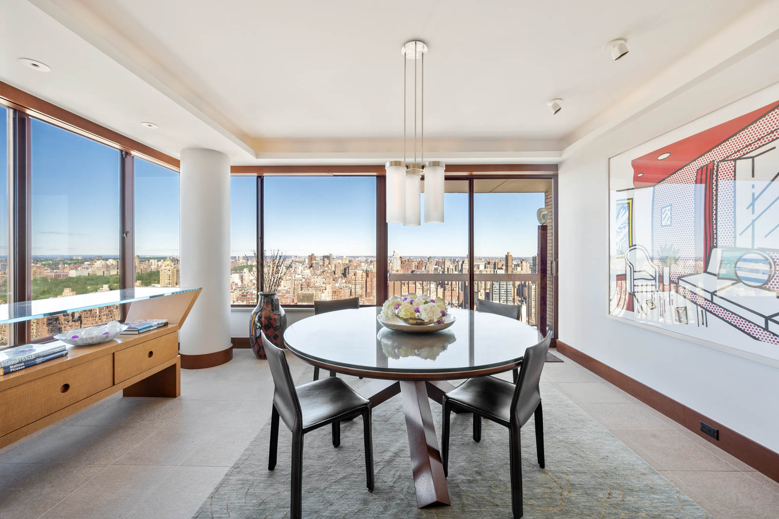 200 East 69th Street, Unit 44A Manhattan, NY 10021 - Photo 3 of 14 a dining room with furniture a chandelier and wooden floor