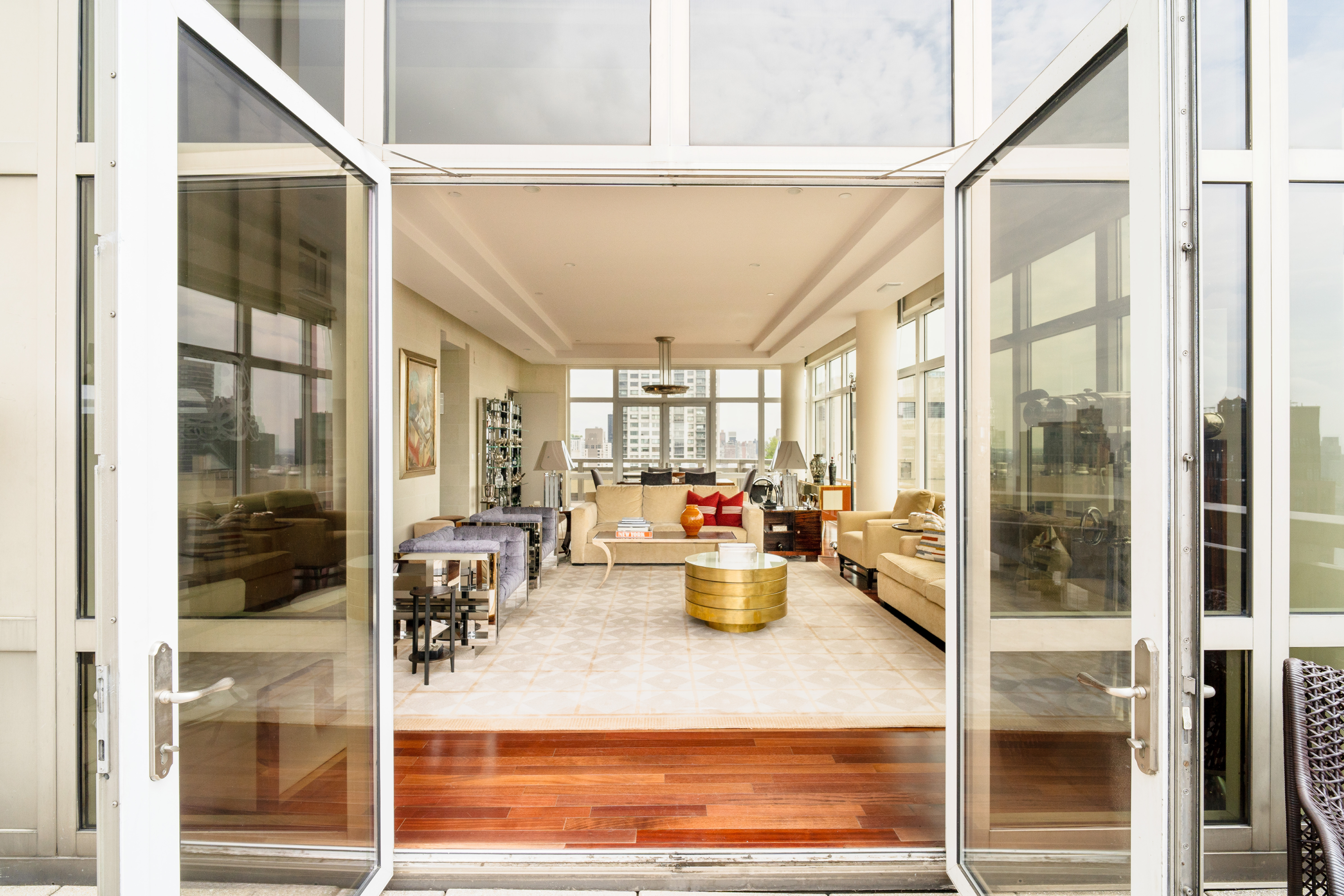 300 East 55th Street, Unit PHC Manhattan, NY 10022 - Photo 5 of 21 a very nice looking living room with a floor to ceiling window and chairs