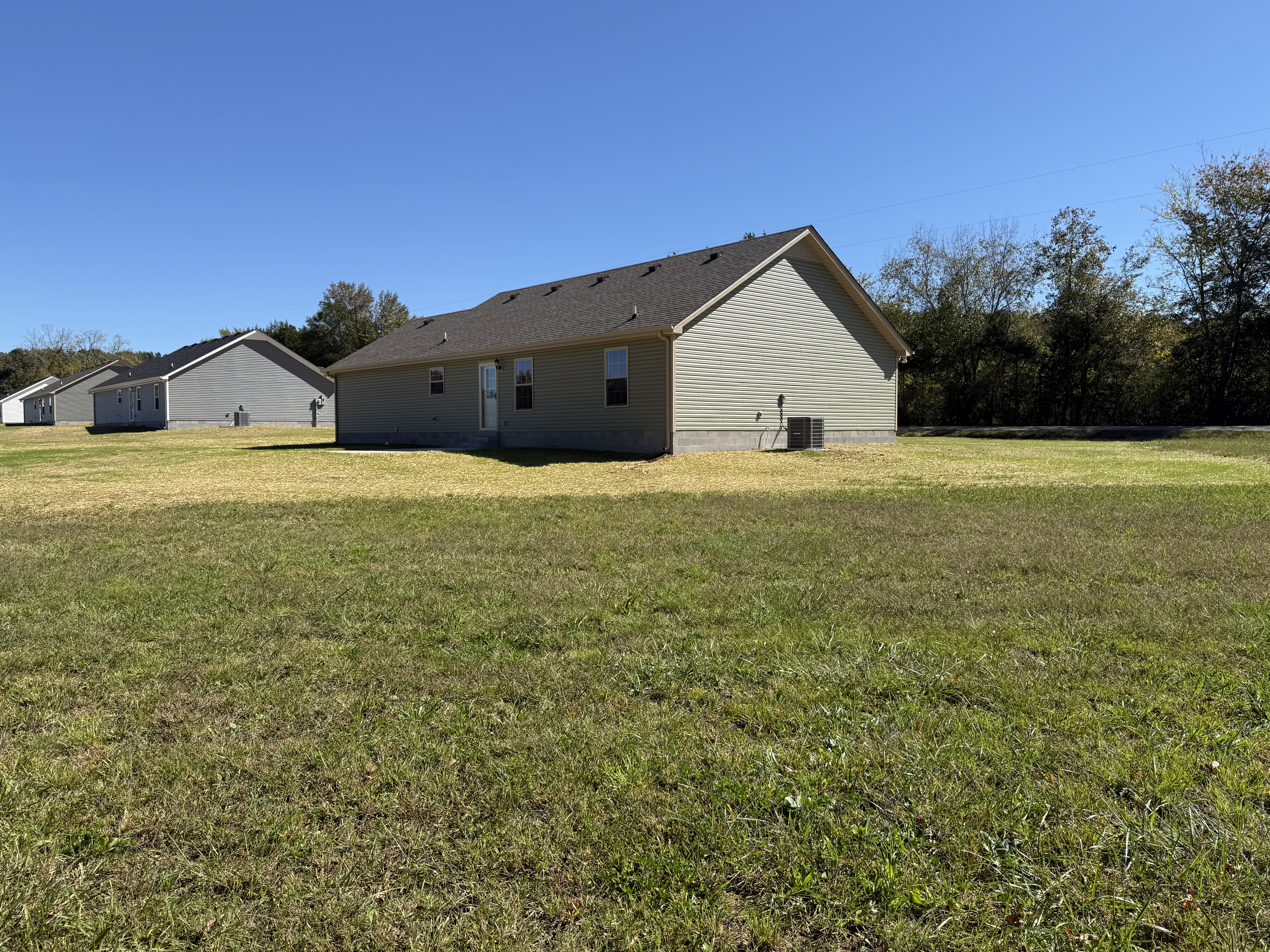 517 Paynes Church Road Estill Springs, TN 37330 - Photo 29 of 32 a big house with yard and a car parked in front of it