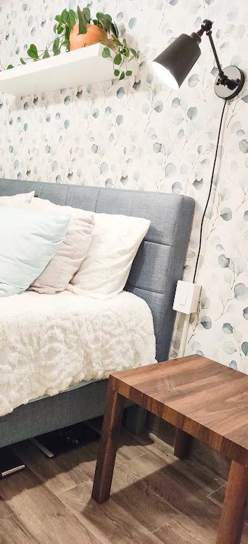 a large white bed in a white room